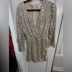 H&M sequin skirt romper! Size small. Skirt and shorts romper.